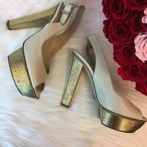 Jimmy Choo cream and gold platform heels.